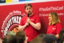 Joshua Simpson, Product Development at AND Digital speaks at the You Got This conference. He is joined on stage by Olivia Marsden, their Graduate Recruitment Lead. They are both wearing red branded AND digital t-shirts.